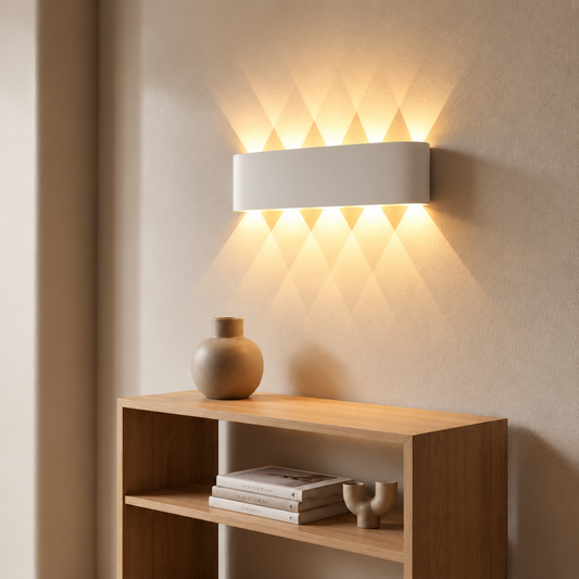 White cordless wall sconce lighting a wall above and below